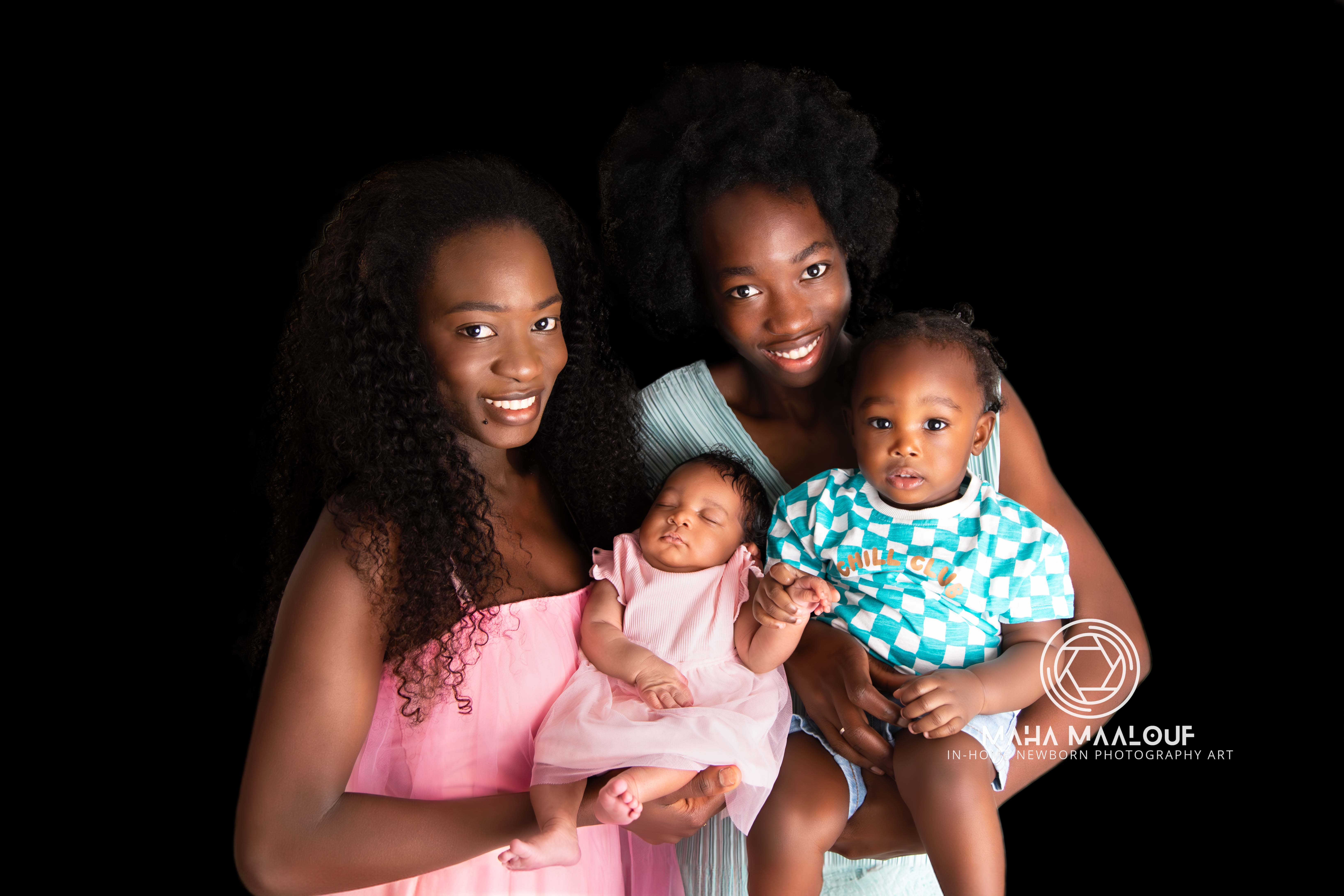Family portrait with newborn baby and older siblings during in-home session