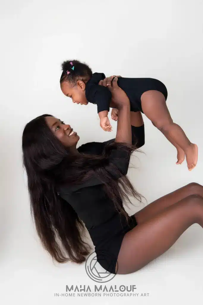 Mother playing with her baby during an in-home family photography session